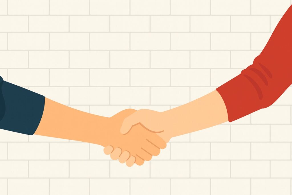 Two Person Shaking Hands Near White Painted Wall