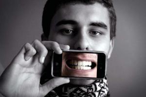 Young man taking a picture of himself